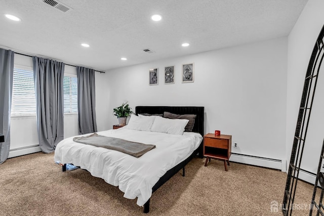 218 Community Cir, Old Bridge, NJ 08857 - bedroom with recessed lighting, carpet floors, a baseboard radiator, and a textured ceiling