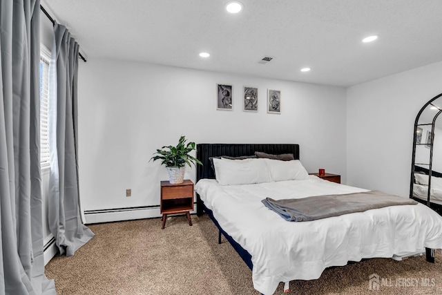 218 Community Cir, Old Bridge, NJ 08857 - bedroom with a baseboard heating unit, carpet flooring, and recessed lighting