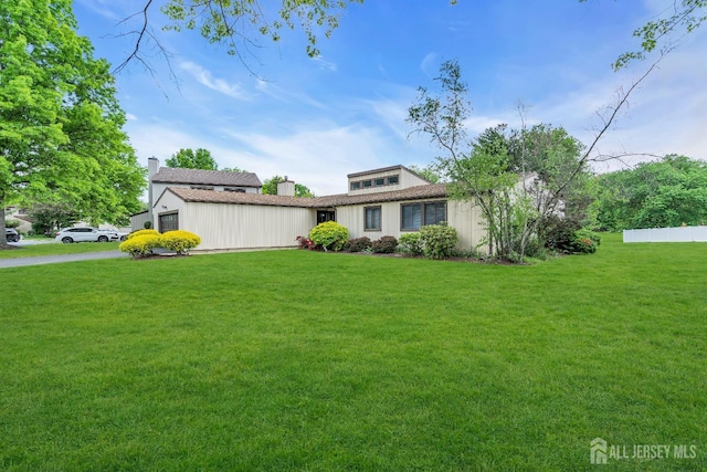 218 Community Cir, Old Bridge, NJ 08857 - view of front of property featuring a front yard and board and batten siding