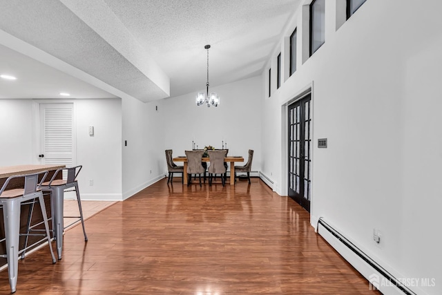 218 Community Cir, Old Bridge, NJ 08857 - dining room with a baseboard radiator, wood finished floors, baseboards, a chandelier, and recessed lighting