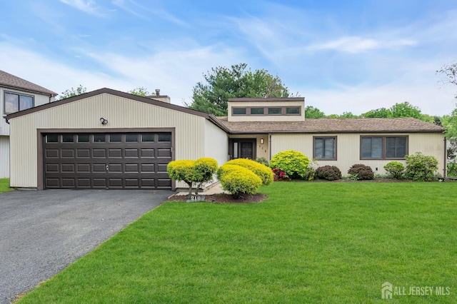 218 Community Cir, Old Bridge, NJ 08857 - mid-century modern home featuring a garage, asphalt driveway, a chimney, and a front yard