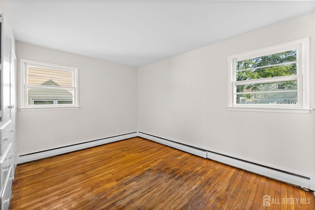 82 Mercer St, Menlo Park Terrace, NJ 08840 - spare room featuring baseboard heating and hardwood / wood-style flooring