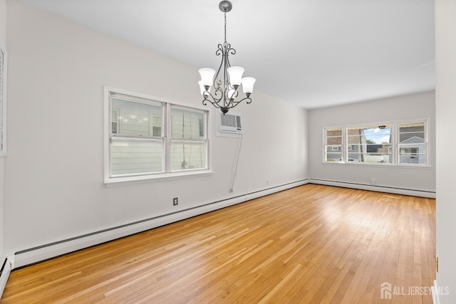 82 Mercer St, Menlo Park Terrace, NJ 08840 - unfurnished room featuring a baseboard heating unit, a chandelier, a wall mounted AC, and hardwood / wood-style flooring