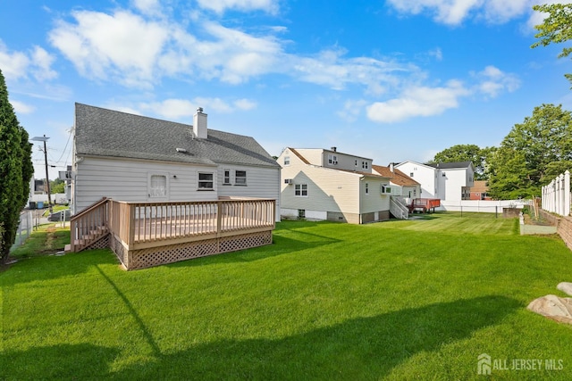 82 Mercer St, Menlo Park Terrace, NJ 08840 - back of property featuring a wooden deck, a chimney, and roof with shingles