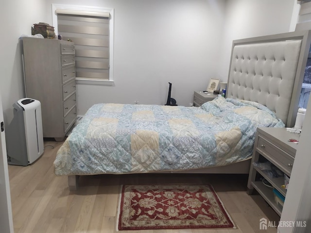 bedroom featuring wood finished floors