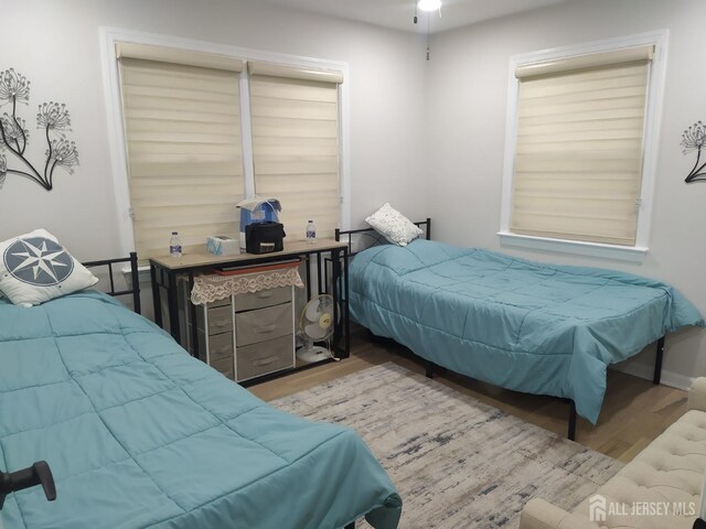 bedroom with wood finished floors