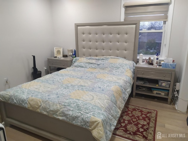 bedroom featuring wood finished floors