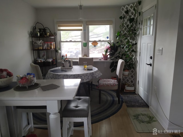 dining room with wood finished floors