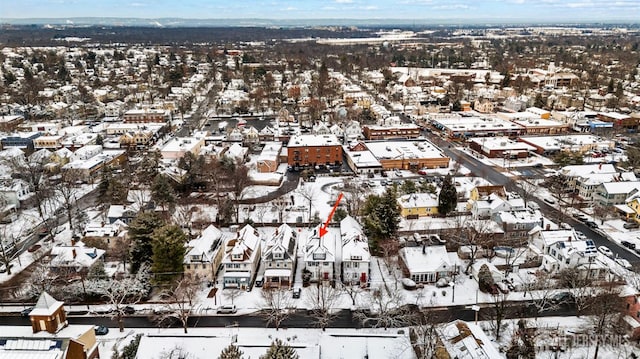 snowy aerial view with a residential view