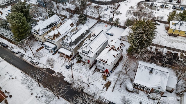 snowy aerial view featuring a residential view