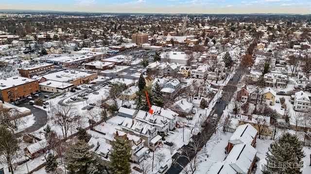 snowy aerial view with a residential view