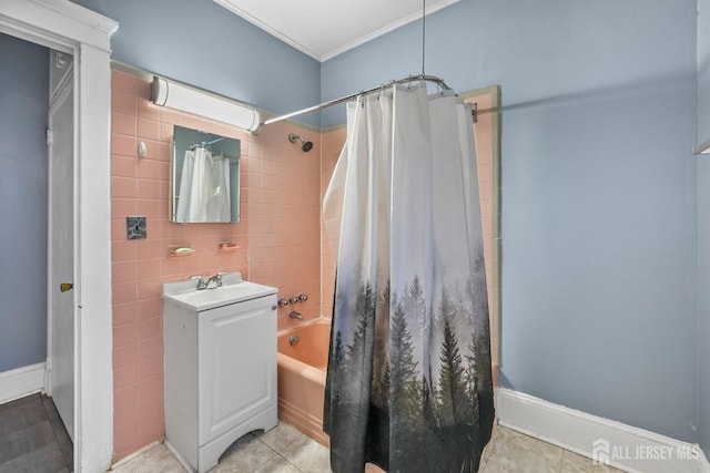 bathroom with tile walls, tile patterned flooring, shower / bathtub combination with curtain, crown molding, and a sink