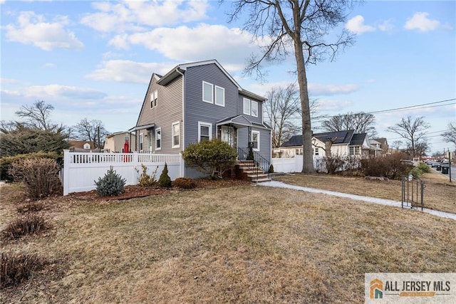 43 Livingston Ave, Avenel, NJ 07001 - view of front of home with fence and a front lawn