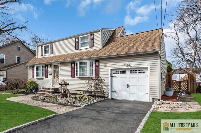 2124 Orchard Dr, South Plainfield, NJ 07080 - view of front facade with an attached garage, aphalt driveway, a front lawn, and roof with shingles