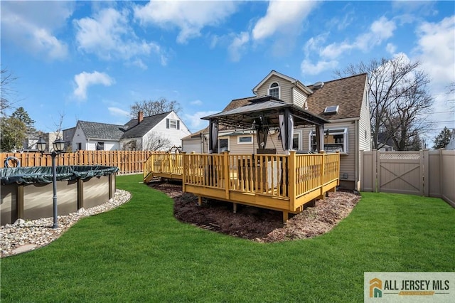 2124 Orchard Dr, South Plainfield, NJ 07080 - rear view of house featuring a gazebo, a fenced in pool, a wooden deck, and a gate