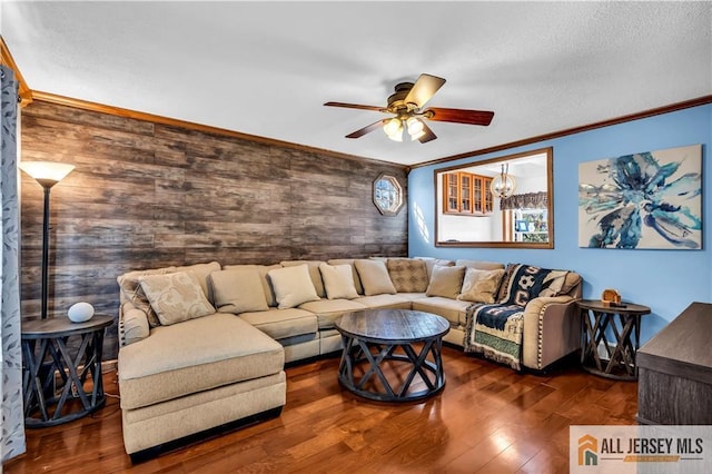 2124 Orchard Dr, South Plainfield, NJ 07080 - living room with ornamental molding, ceiling fan with notable chandelier, wood finished floors, and wooden walls