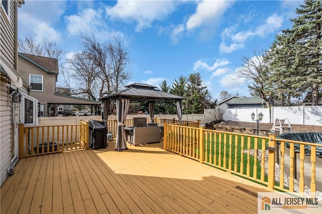 2124 Orchard Dr, South Plainfield, NJ 07080 - wooden deck with a fenced backyard, a gazebo, and a lawn