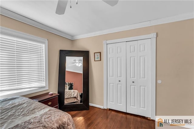 2124 Orchard Dr, South Plainfield, NJ 07080 - bedroom featuring crown molding, dark wood-type flooring, a closet, and ceiling fan