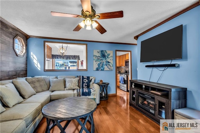 2124 Orchard Dr, South Plainfield, NJ 07080 - living room with ornamental molding, a textured ceiling, ceiling fan, and wood finished floors