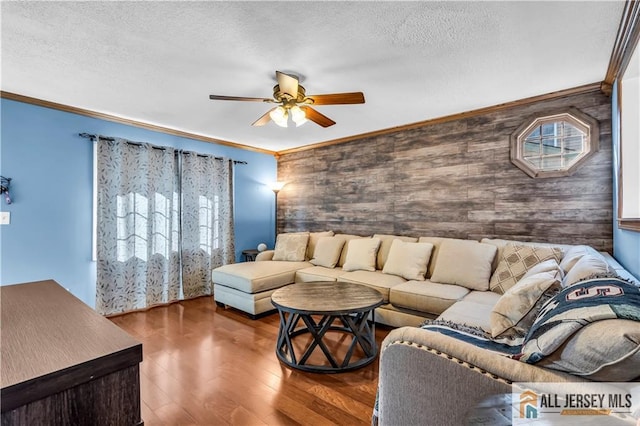 2124 Orchard Dr, South Plainfield, NJ 07080 - living area featuring crown molding, wood finished floors, ceiling fan, wooden walls, and a textured ceiling