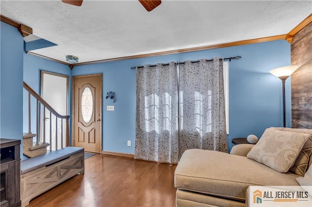 2124 Orchard Dr, South Plainfield, NJ 07080 - interior space featuring a textured ceiling, stairs, a ceiling fan, wood finished floors, and ornamental molding