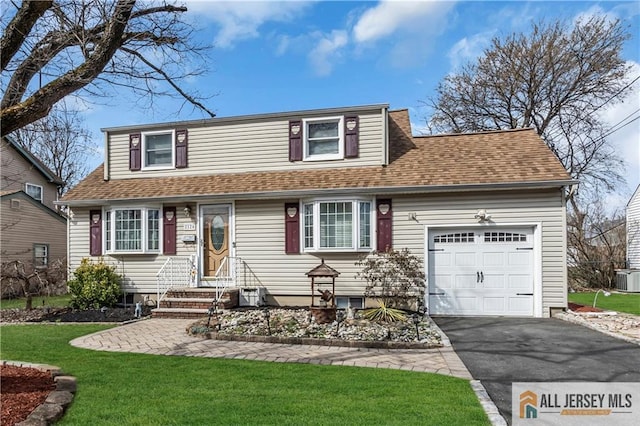 2124 Orchard Dr, South Plainfield, NJ 07080 - view of front of home with roof with shingles, an attached garage, a front yard, and aphalt driveway