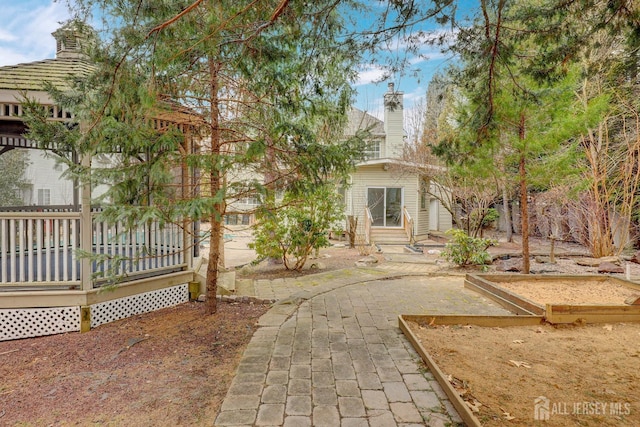 view of front of property featuring a chimney