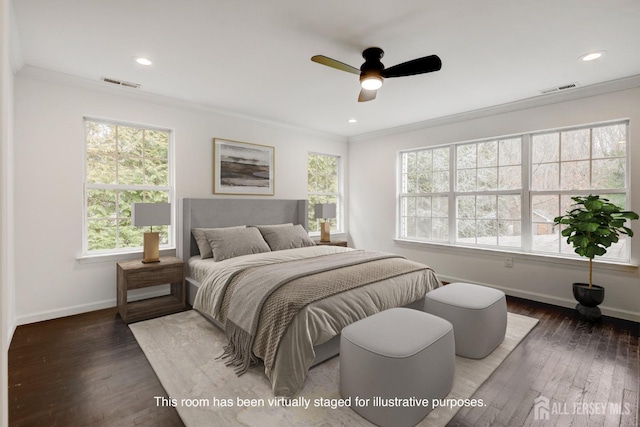 bedroom with multiple windows, visible vents, and crown molding