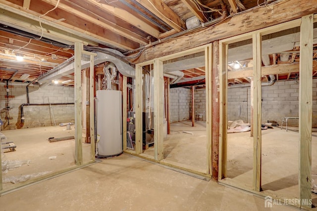 unfinished basement featuring water heater