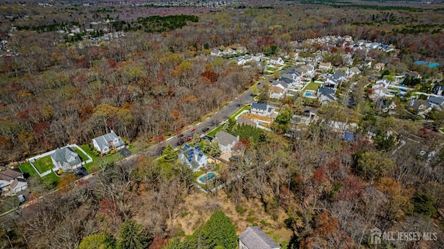 bird's eye view with a forest view and a residential view