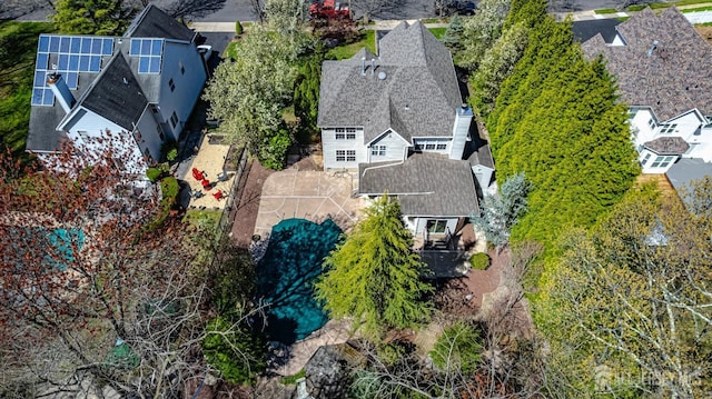 birds eye view of property with a residential view
