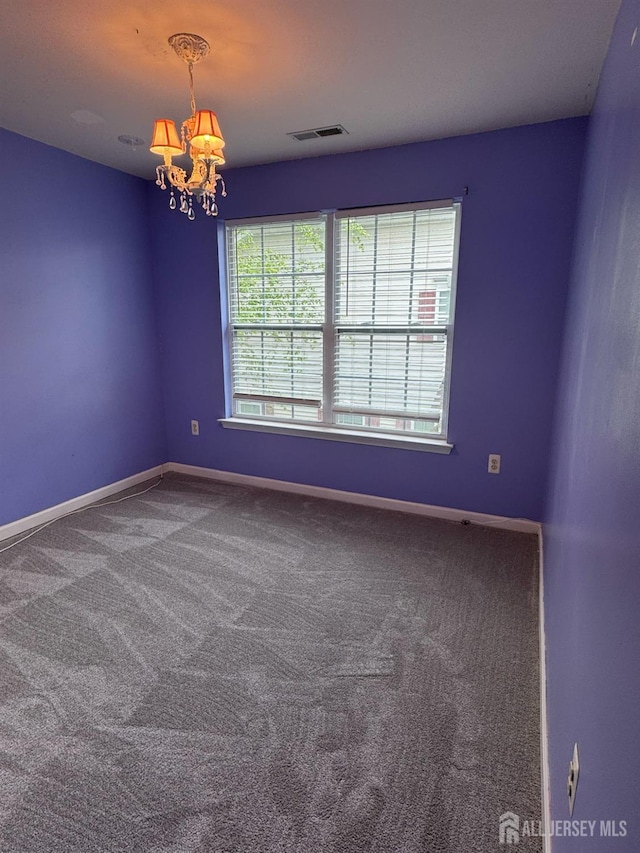 1057 Morning Glory Dr, Monroe, NJ 08831 - empty room featuring a chandelier, carpet flooring, and baseboards