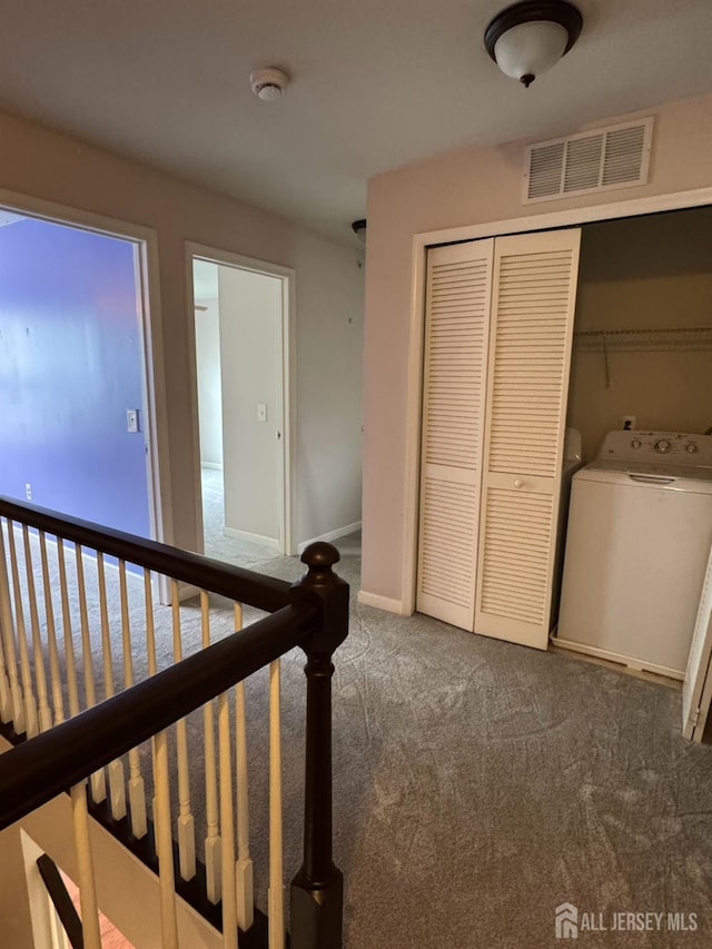 1057 Morning Glory Dr, Monroe, NJ 08831 - corridor featuring washer / dryer, carpet flooring, and baseboards