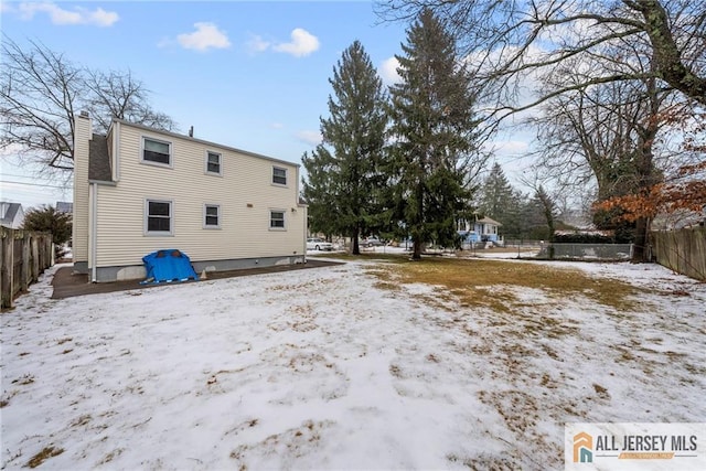 view of snow covered house