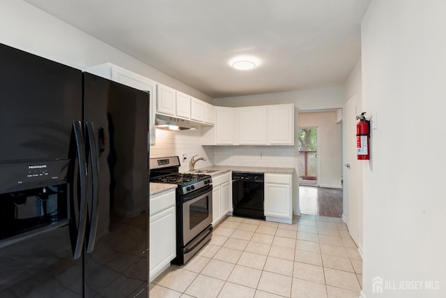 18 Lake Ave Unit 8A, East Brunswick, NJ 08816 - kitchen with black appliances, under cabinet range hood, backsplash, and white cabinets