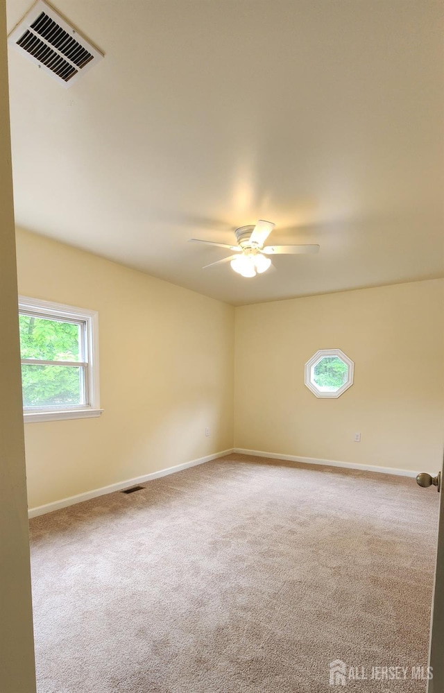 20 Brunswick Ave, Spotswood, NJ 08884 - carpeted empty room with a ceiling fan and baseboards