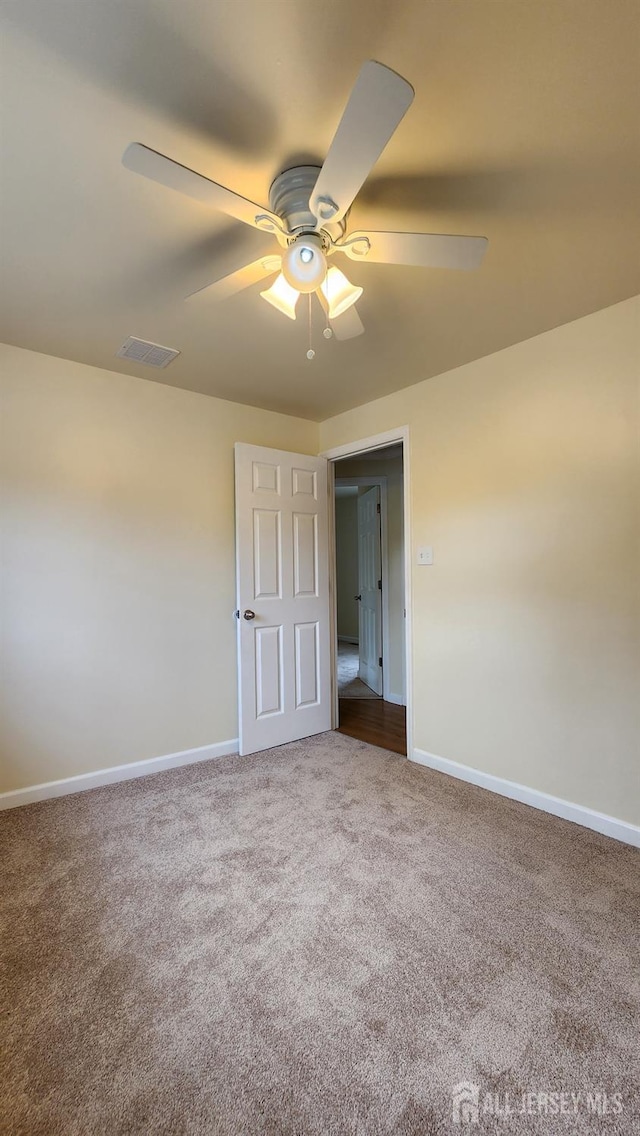 20 Brunswick Ave, Spotswood, NJ 08884 - spare room featuring a ceiling fan and carpet flooring