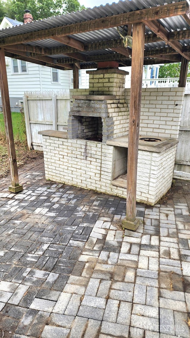 20 Brunswick Ave, Spotswood, NJ 08884 - view of patio with an outdoor brick fireplace