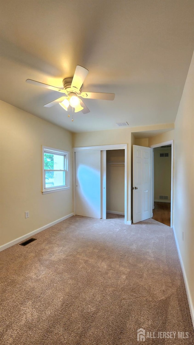 20 Brunswick Ave, Spotswood, NJ 08884 - unfurnished bedroom with carpet flooring, a closet, and ceiling fan