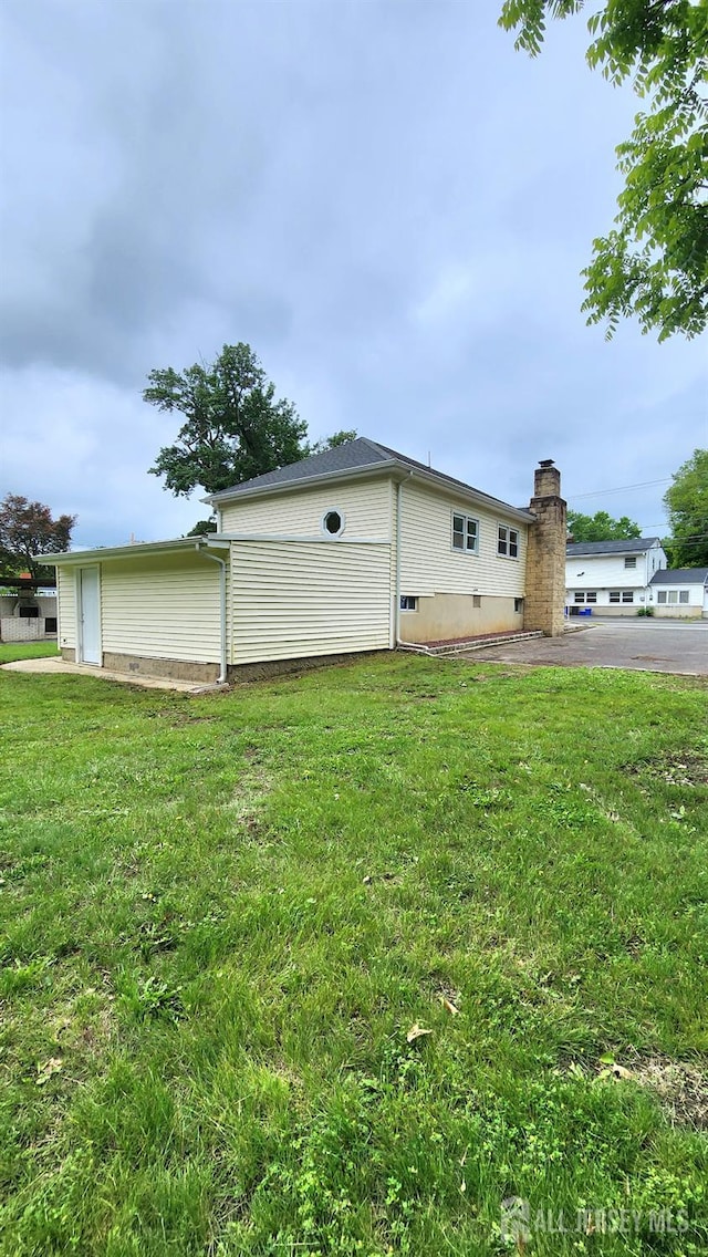 20 Brunswick Ave, Spotswood, NJ 08884 - view of home's exterior with a lawn