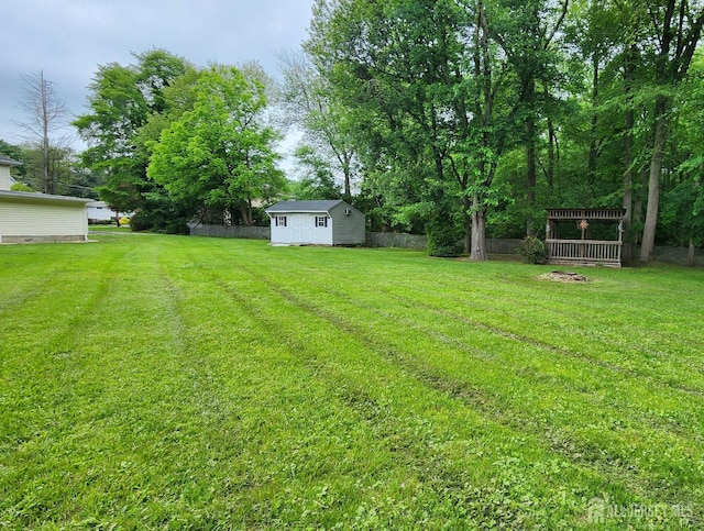 20 Brunswick Ave, Spotswood, NJ 08884 - view of grassy yard featuring a storage shed