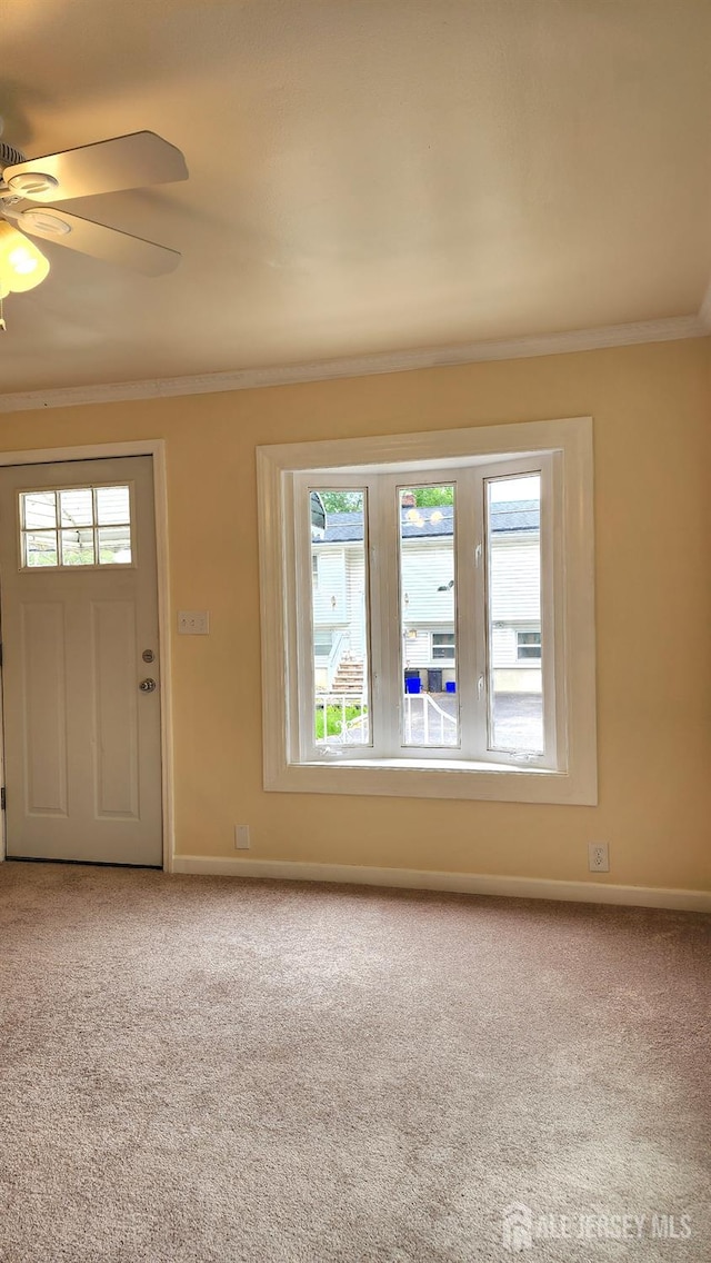 20 Brunswick Ave, Spotswood, NJ 08884 - entrance foyer featuring crown molding, carpet, and ceiling fan