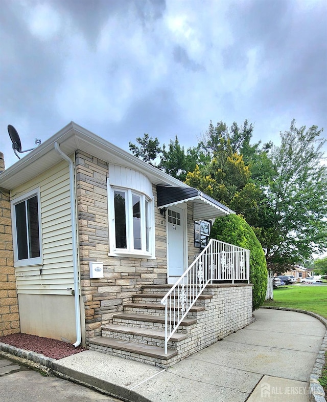 20 Brunswick Ave, Spotswood, NJ 08884 - view of front facade with stone siding