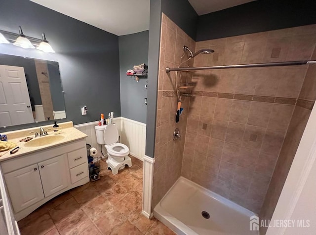 54 Washington Rd, Sayreville, NJ 08872 - bathroom with a stall shower, vanity, toilet, and a wainscoted wall