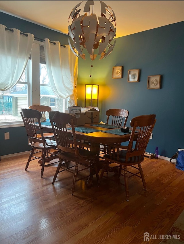 54 Washington Rd, Sayreville, NJ 08872 - dining space featuring wood finished floors, baseboards, and a chandelier