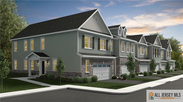 21 Kearns Pl Unit 3906, South Brunswick, NJ 08852 - view of front of house featuring stone siding, a garage, board and batten siding, and a shingled roof