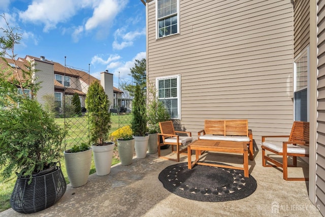 view of patio with fence and an outdoor living space