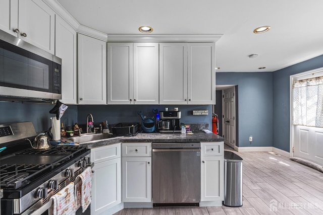 76 Woodland Dr, Keyport, NJ 07735 - kitchen featuring appliances with stainless steel finishes, a sink, white cabinets, baseboards, and recessed lighting