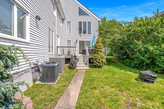 76 Woodland Dr, Keyport, NJ 07735 - view of grassy yard with central air condition unit and a wooden deck