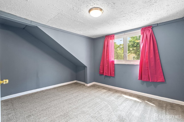 76 Woodland Dr, Keyport, NJ 07735 - carpeted empty room featuring a textured ceiling and baseboards